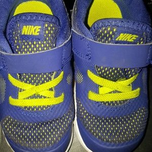 Worn Blue Nike kids shoes size 7c